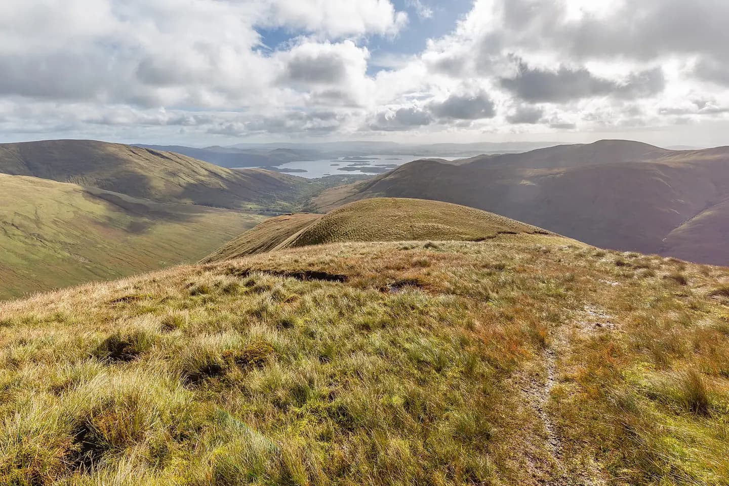 Golden grass on the Luss Hills, with Loch Lomond and its islands far below