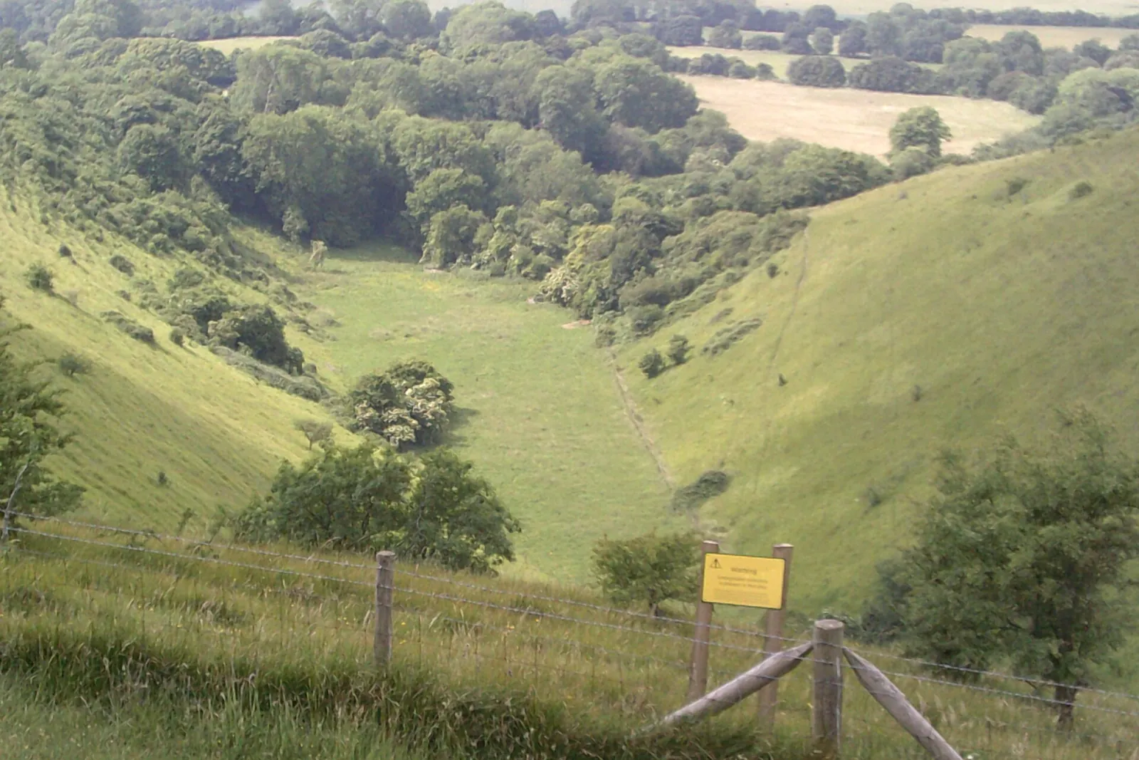 Sunlight on the steep grassy sides of the Devil's Kneading Trough, a dry valley in the Wye Downs