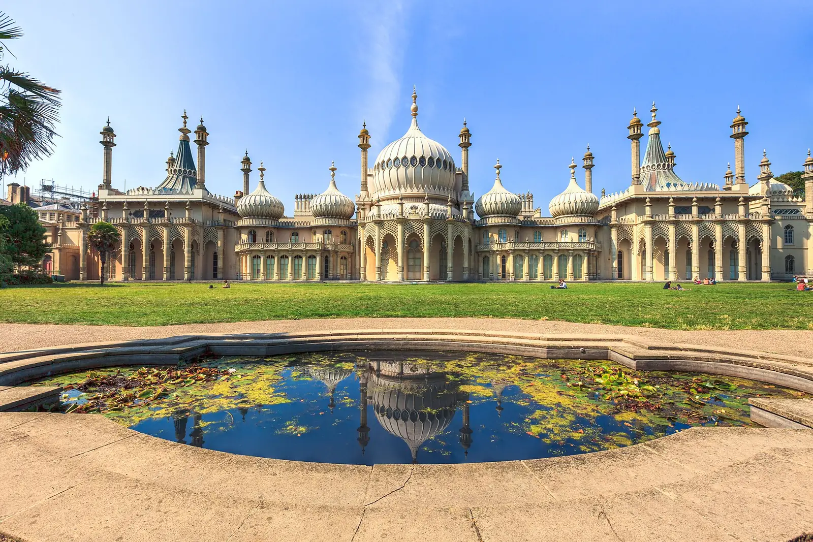 The domes and minarets of the Royal Pavilion reflected in a pond in its gardens