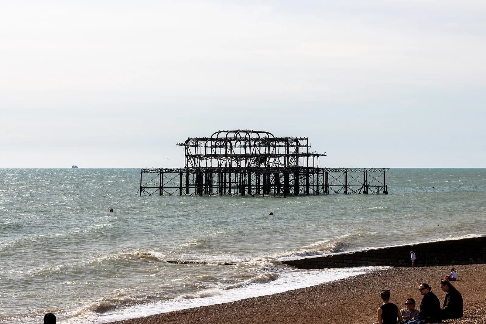 The skeletal iron ruins of Brighton's West Pier standing in the sea