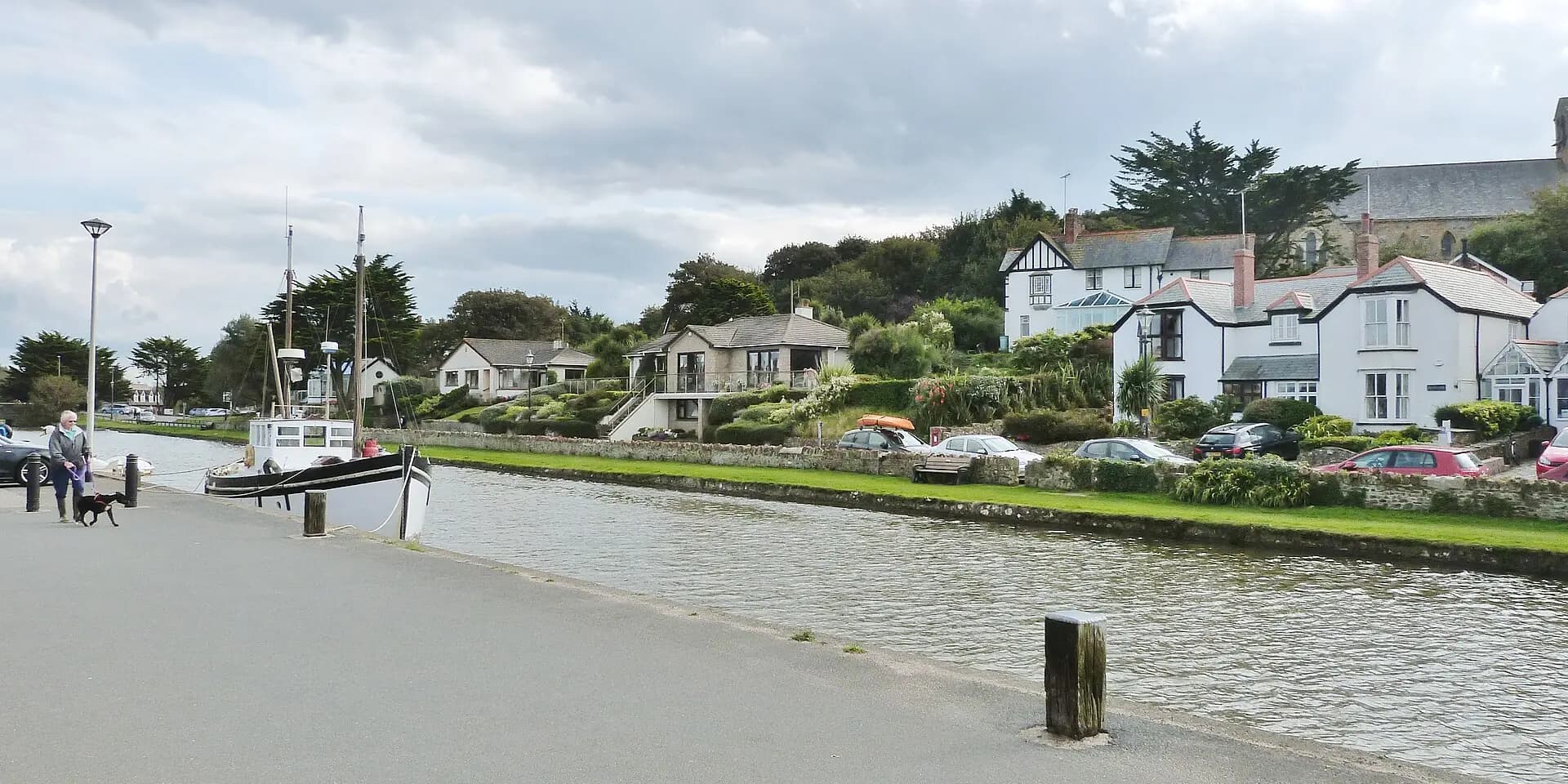 Bude Canal with a moored boat and white houses along the bank