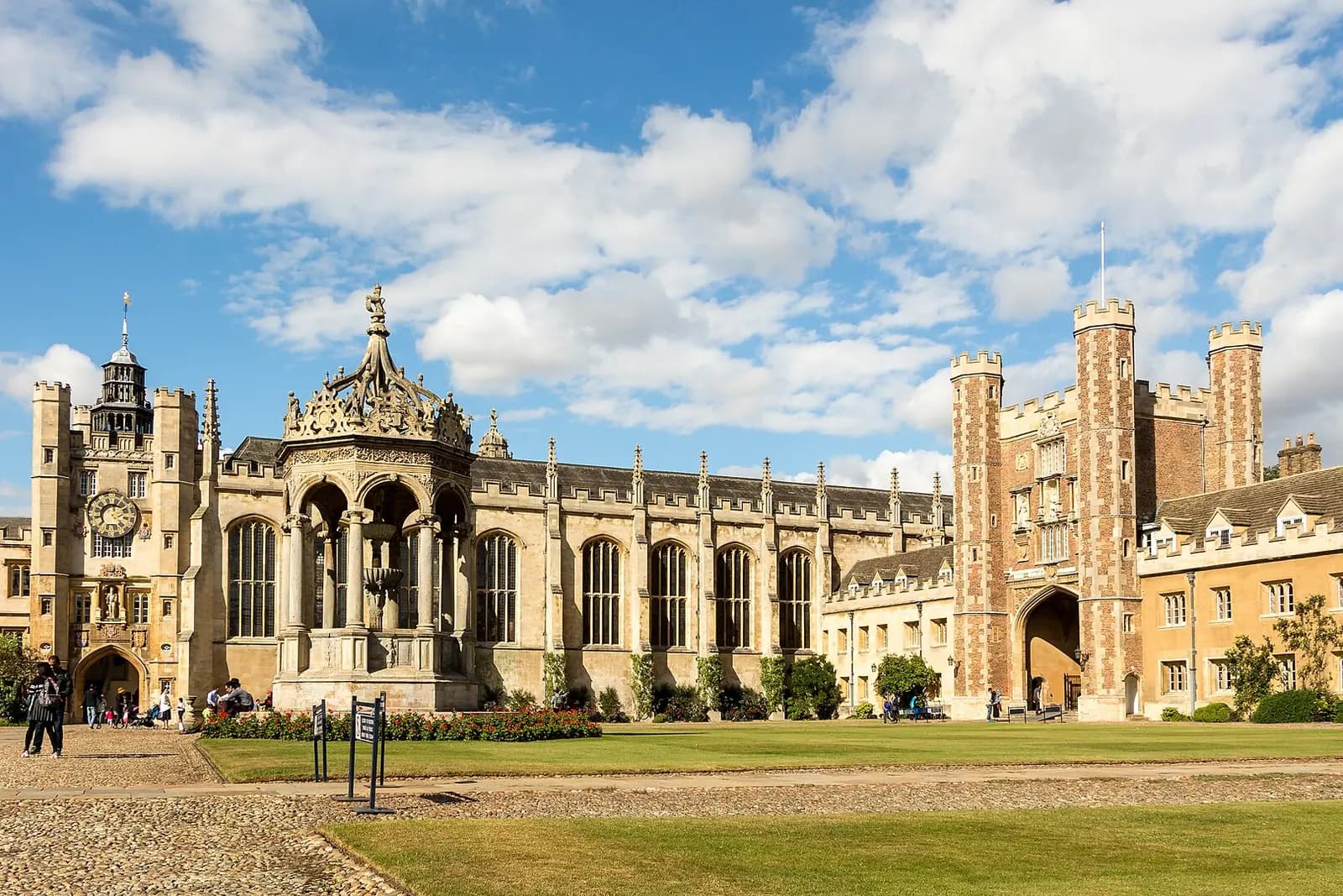 Trinity College's Great Court, with its fountain, chapel and gate towers around a lawn