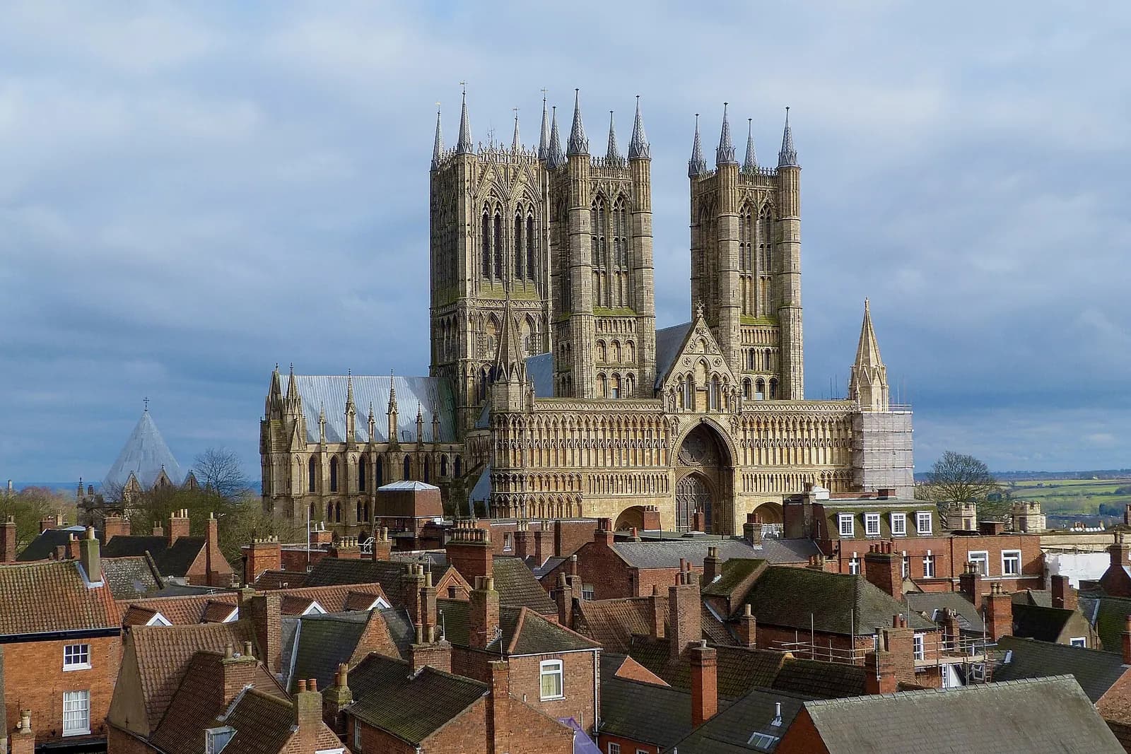 Lincoln Cathedral's three towers rising above the old town's rooftops, seen from Lincoln Castle
