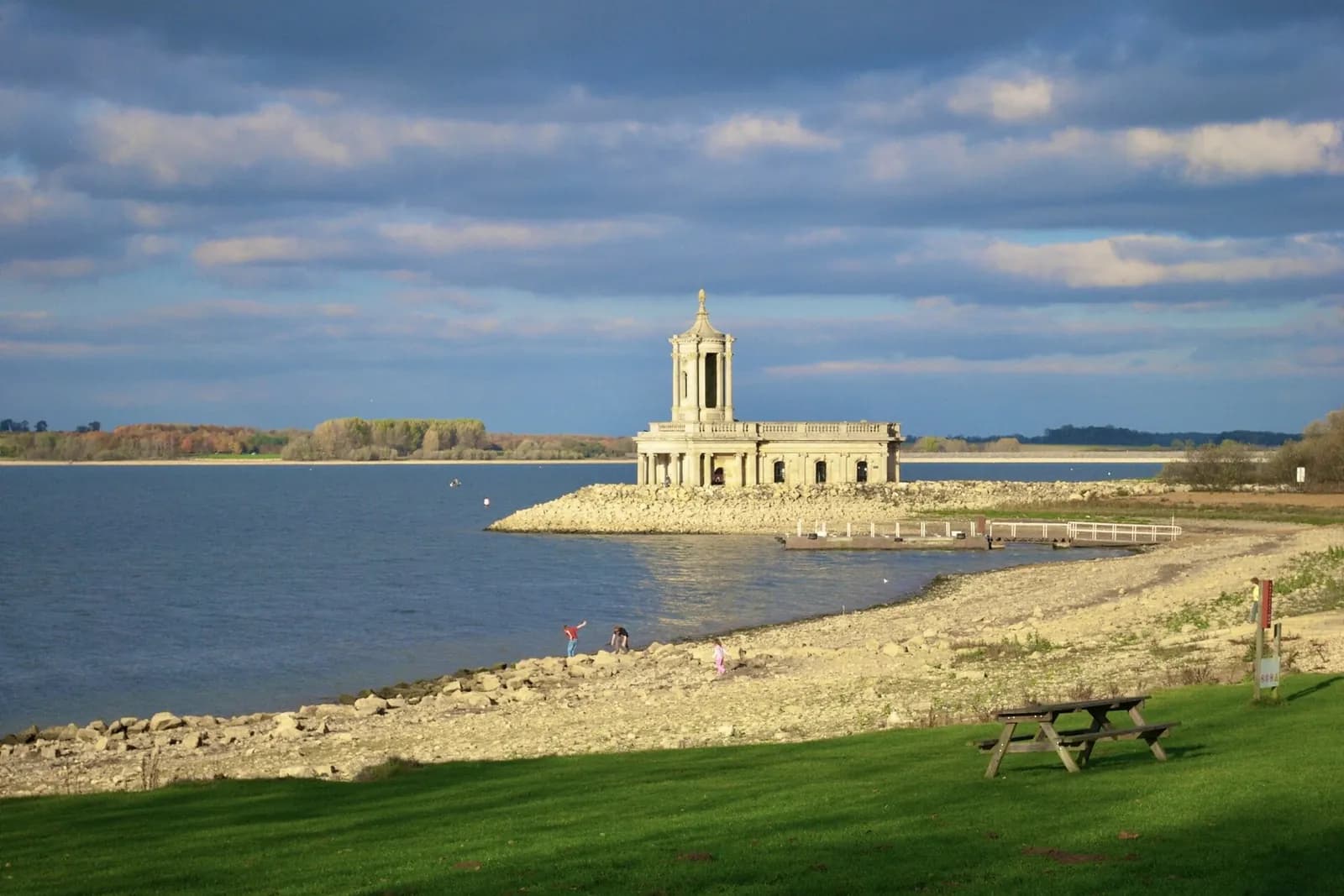 Normanton Church standing at the edge of Rutland Water, with the reservoir stretching away