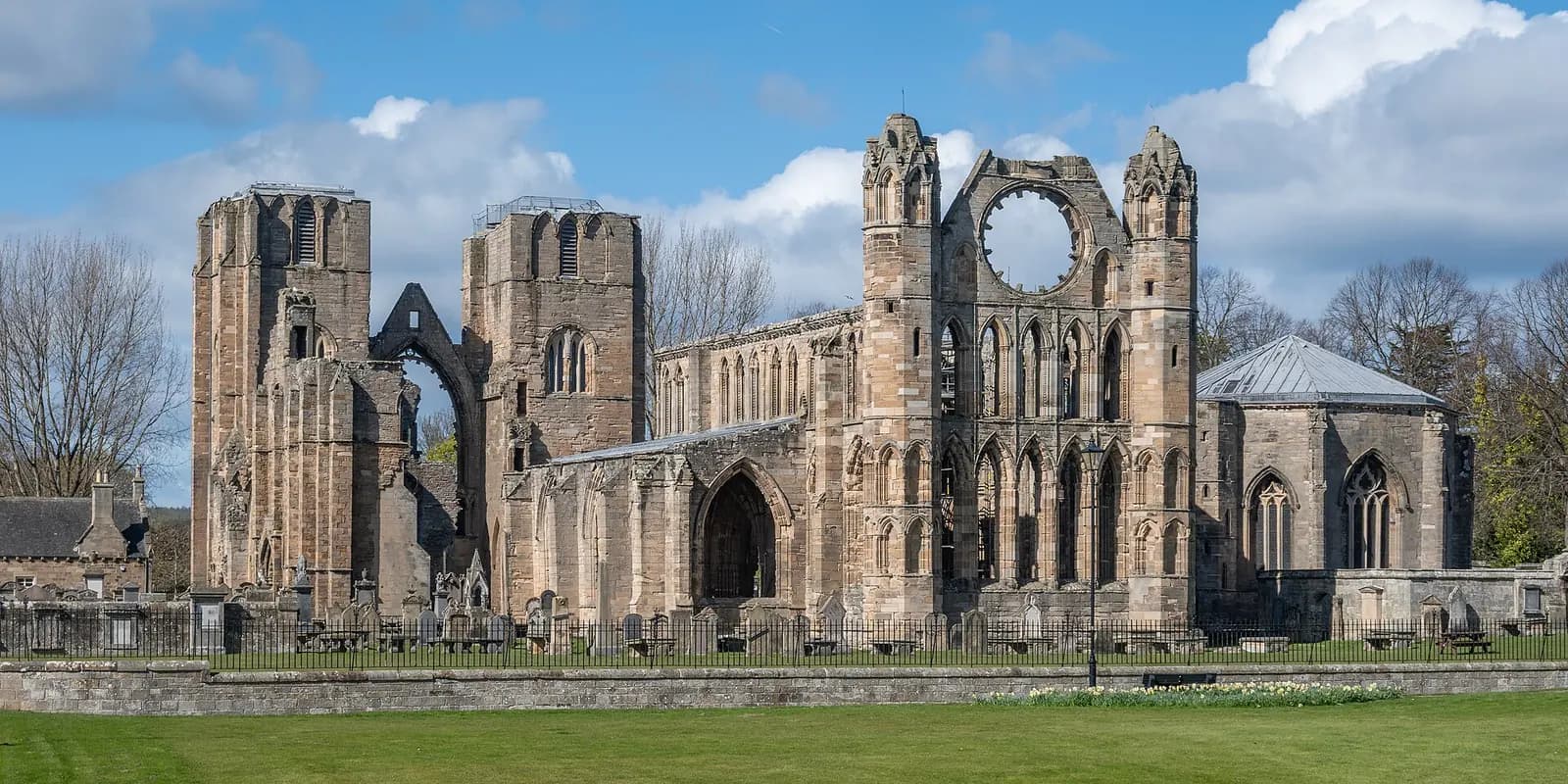 The roofless red sandstone ruins of Elgin Cathedral, with its twin towers and great rose window