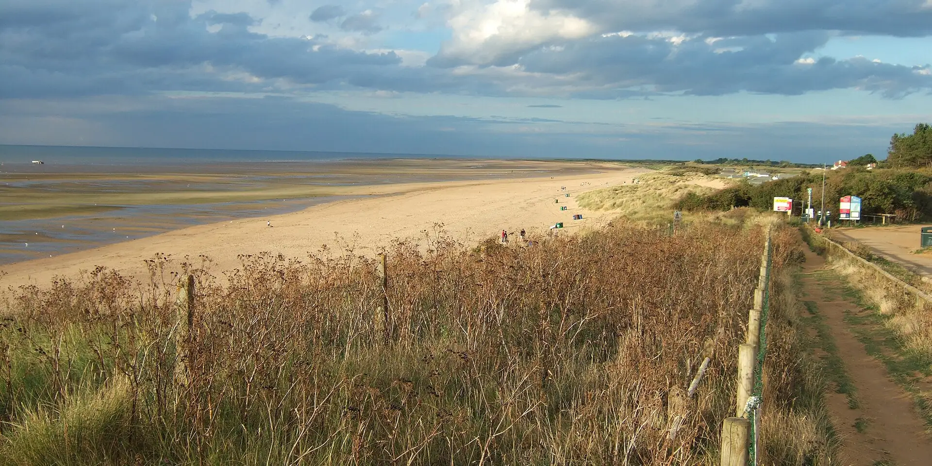 The wide sandy beach at Old Hunstanton, with dunes and grasses along the shore