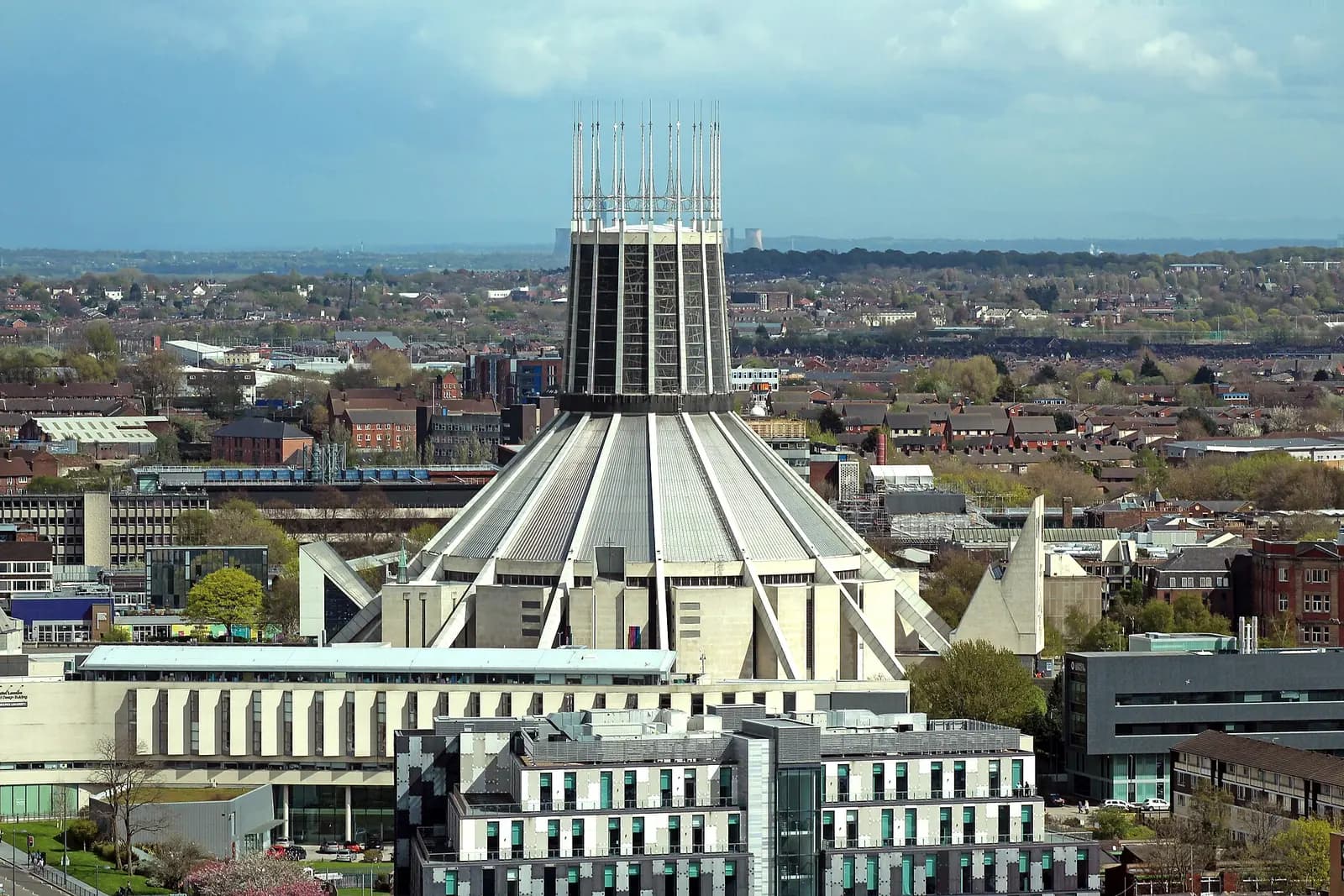 The crown-like tower of Liverpool Metropolitan Cathedral, seen from above with the city around it