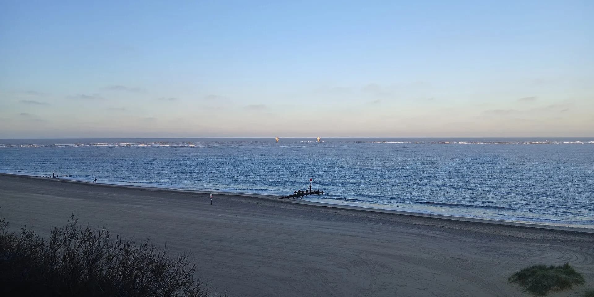 Lowestoft's wide sandy beach and the North Sea at dusk