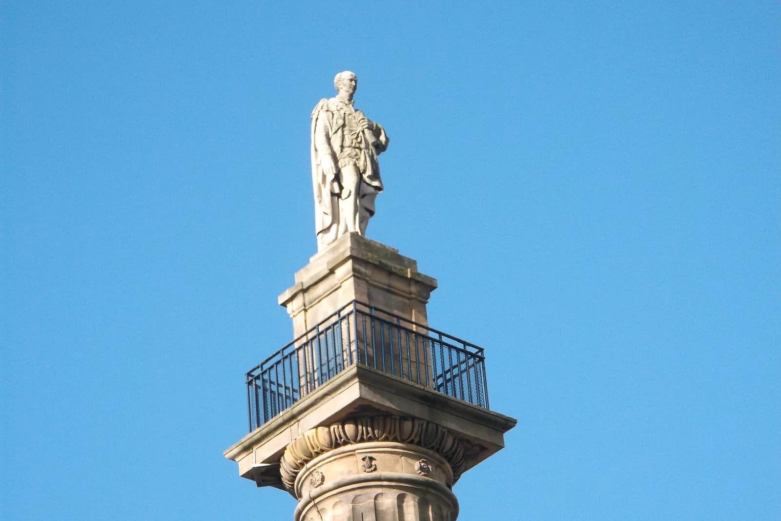 The statue of Earl Grey on top of Grey's Monument against a clear blue sky