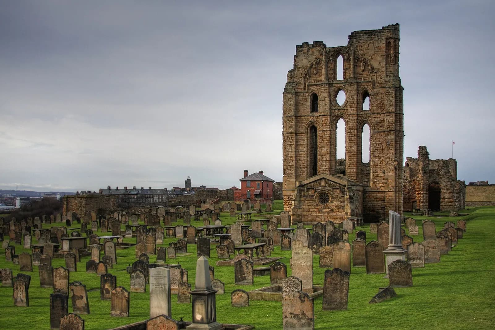 The ruined priory church at Tynemouth rising above its old graveyard