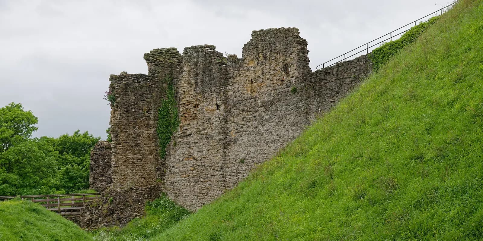 The ruined stone keep of Pickering Castle on its steep grassy motte