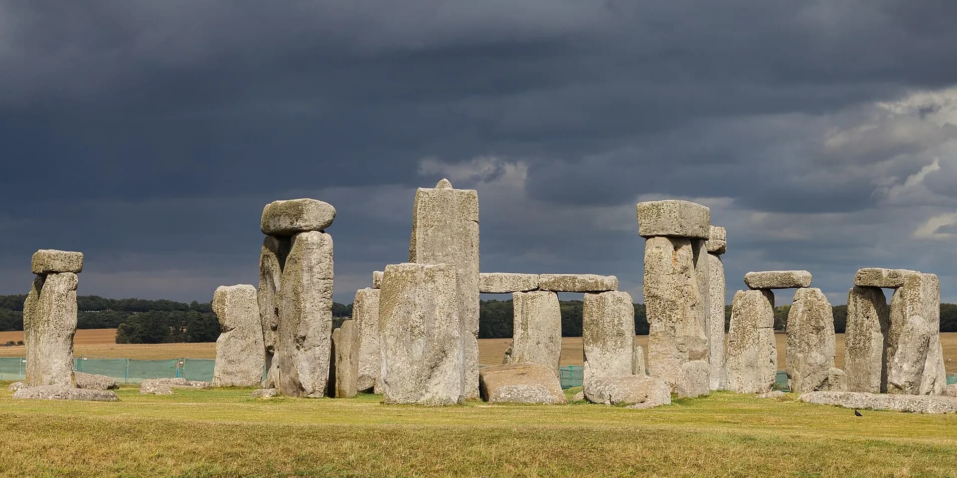 The great standing stones of Stonehenge under a stormy sky