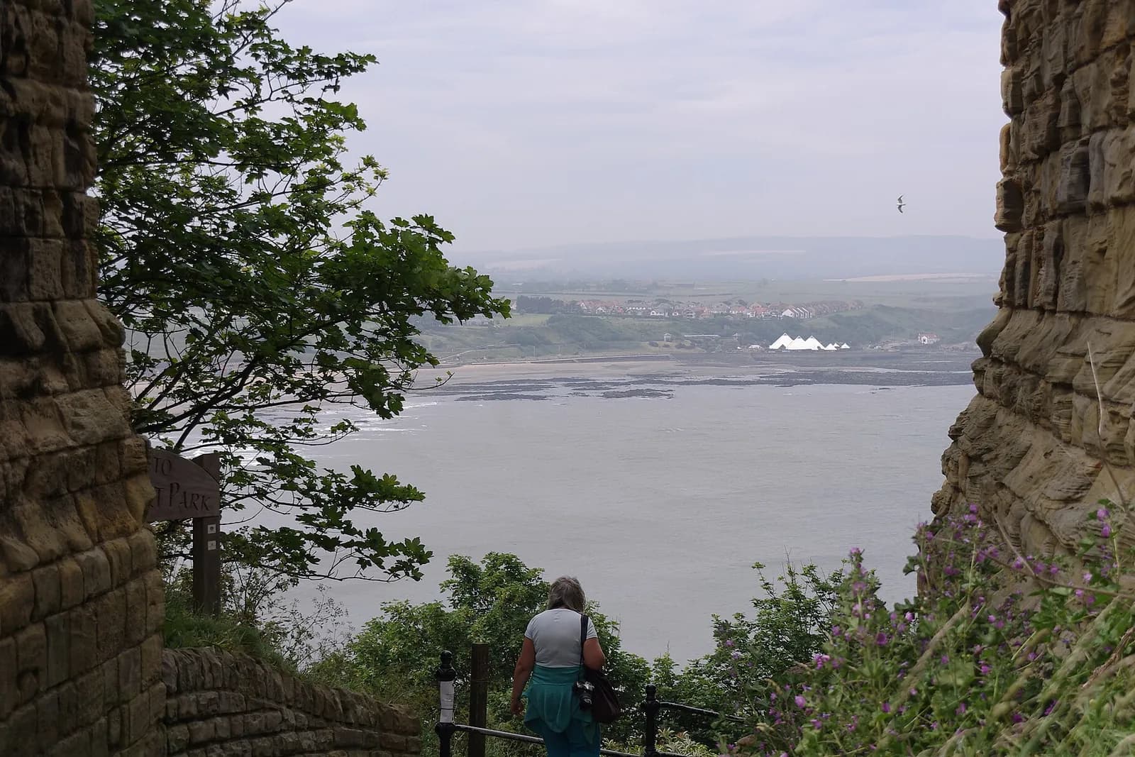 Scarborough's North Bay seen through a gap in the walls of Scarborough Castle