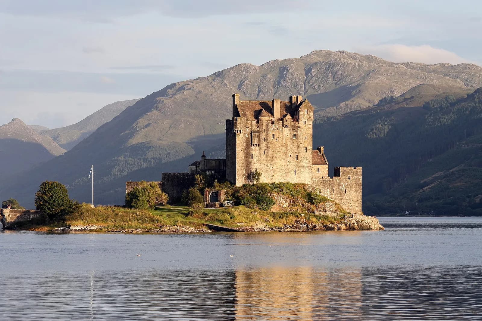 Eilean Donan Castle on its small island in the loch, with mountains behind