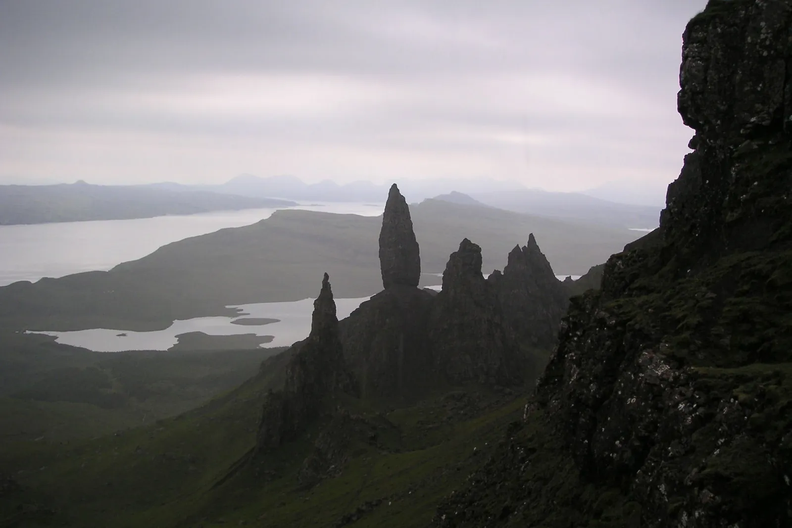 The rock pinnacles of the Old Man of Storr on Skye, with lochs and islands below