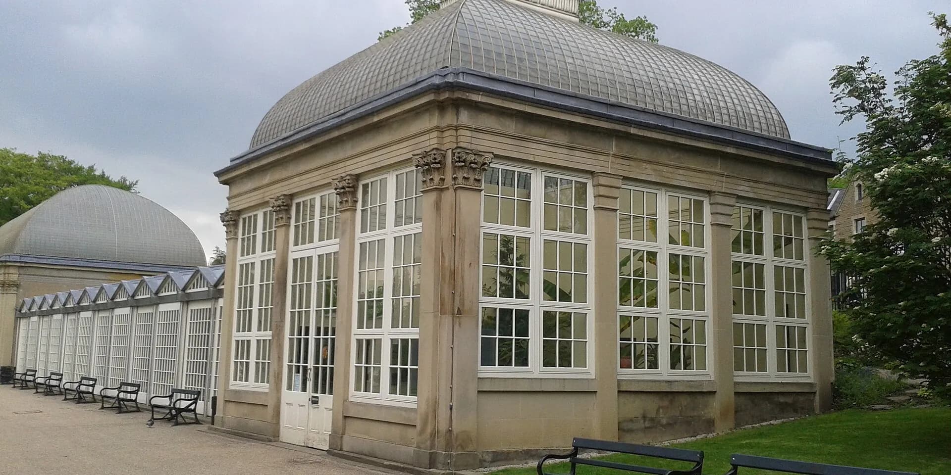 The curved glass and stone pavilions of Sheffield Botanical Gardens