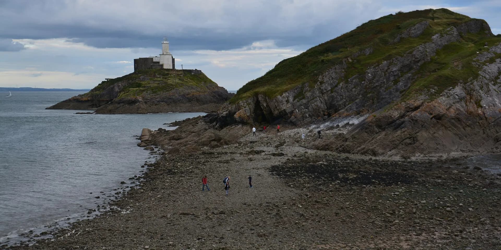 Mumbles Head and its lighthouse island at low tide, on Swansea Bay