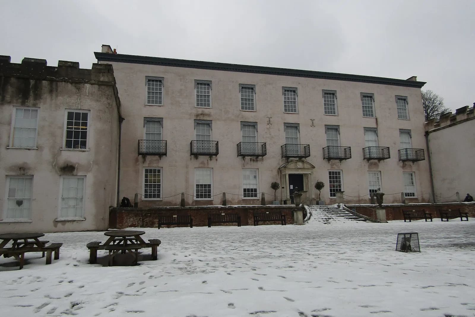 Torre Abbey's long stone front after a fall of snow
