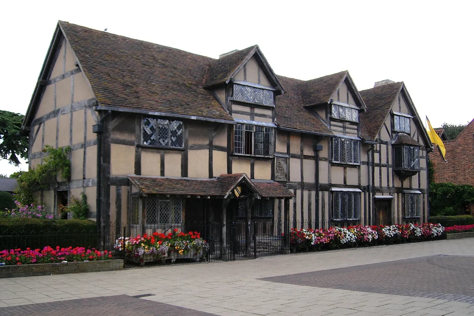 Shakespeare's Birthplace, a timber-framed house in Stratford-upon-Avon, with flower beds in front