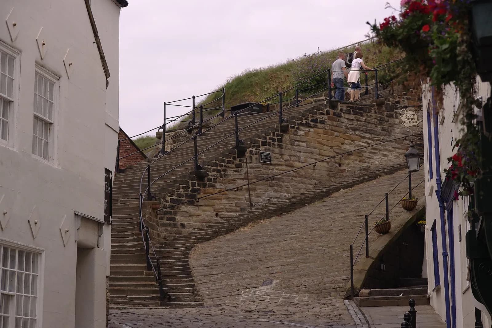 The 199 Steps climbing between old houses up to St Mary's Church in Whitby