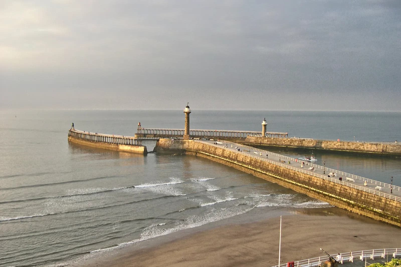 Whitby's two curving harbour piers and their lighthouses reaching out into the sea