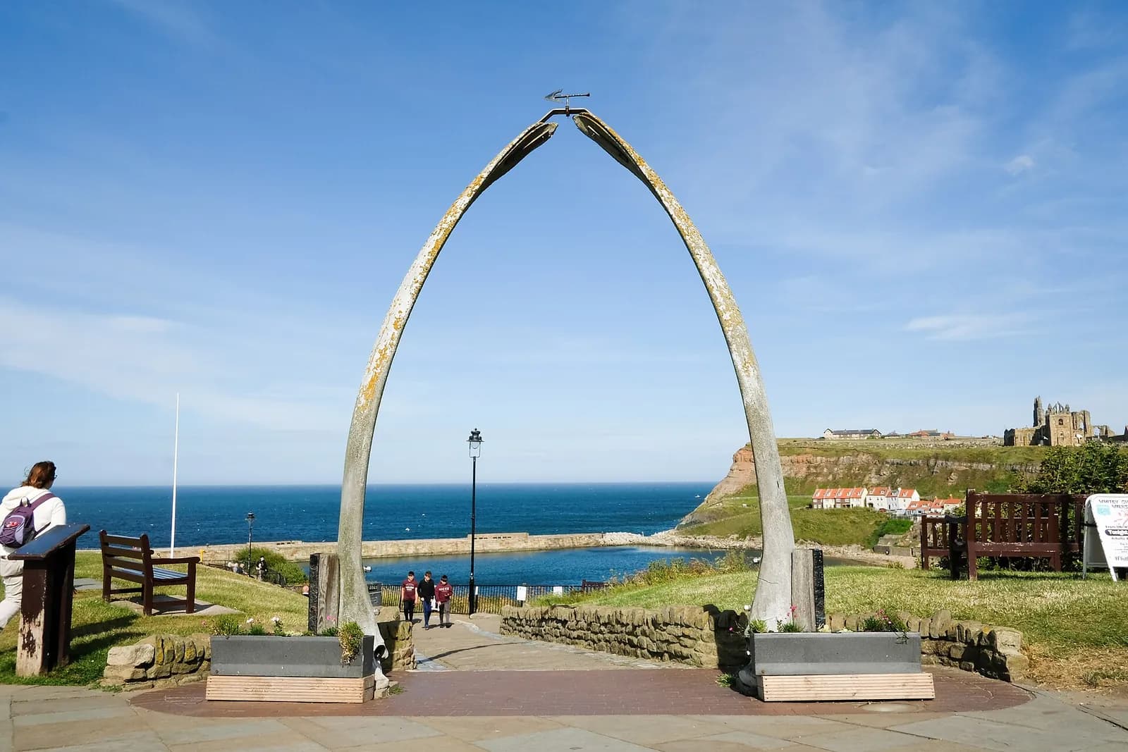 The whalebone arch on Whitby's West Cliff, framing the harbour and the abbey across the water