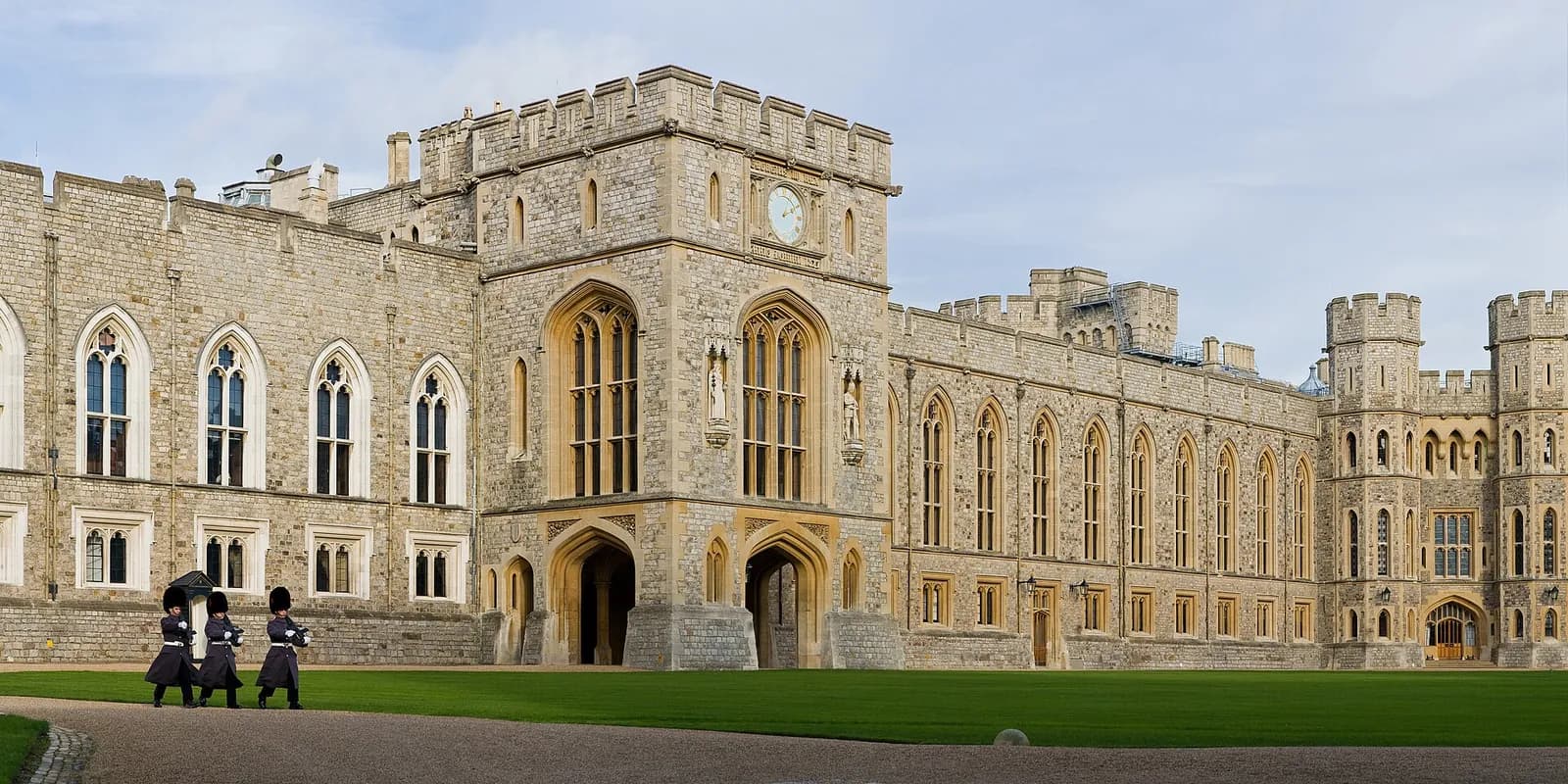 The Upper Ward of Windsor Castle, its grey stone towers around a green lawn