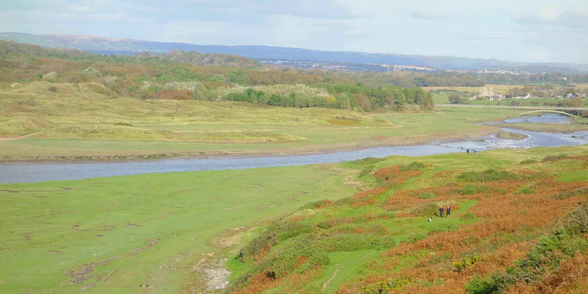 The Ogmore river winding through green and russet countryside, with hills on the horizon