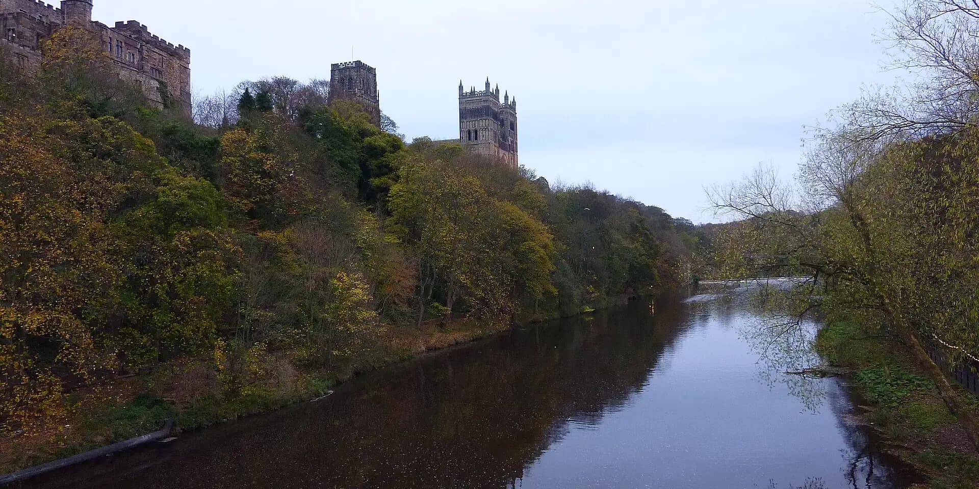 The River Wear winding below wooded banks, with the towers of Durham Cathedral above