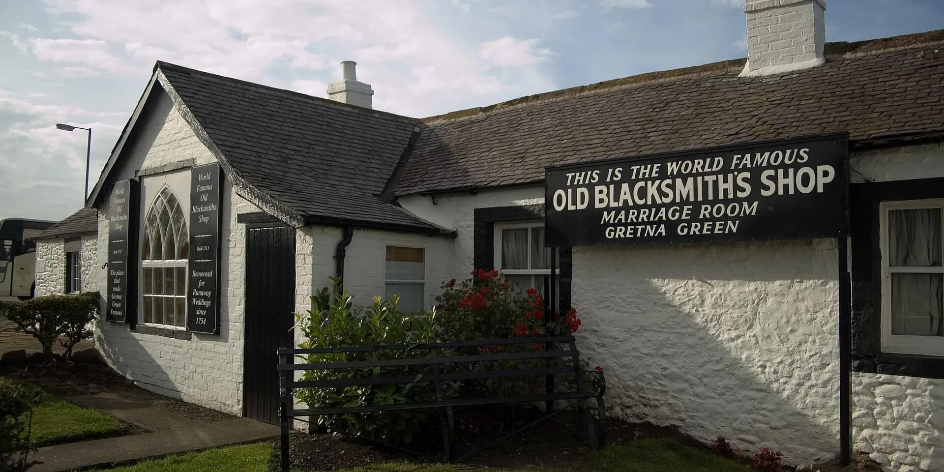 The whitewashed Old Blacksmith's Shop at Gretna Green, with its famous sign above the door