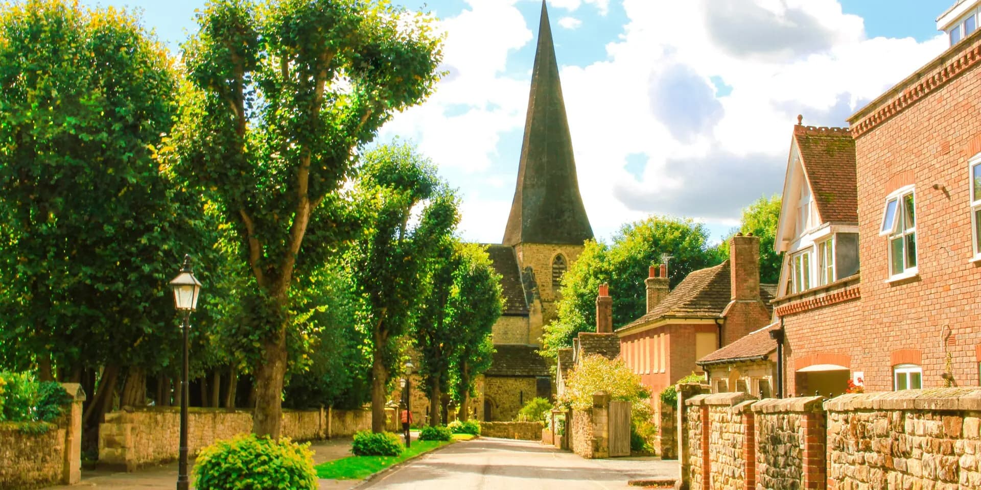 The Causeway in Horsham, a tree-lined lane of old houses leading to St Mary's Church spire