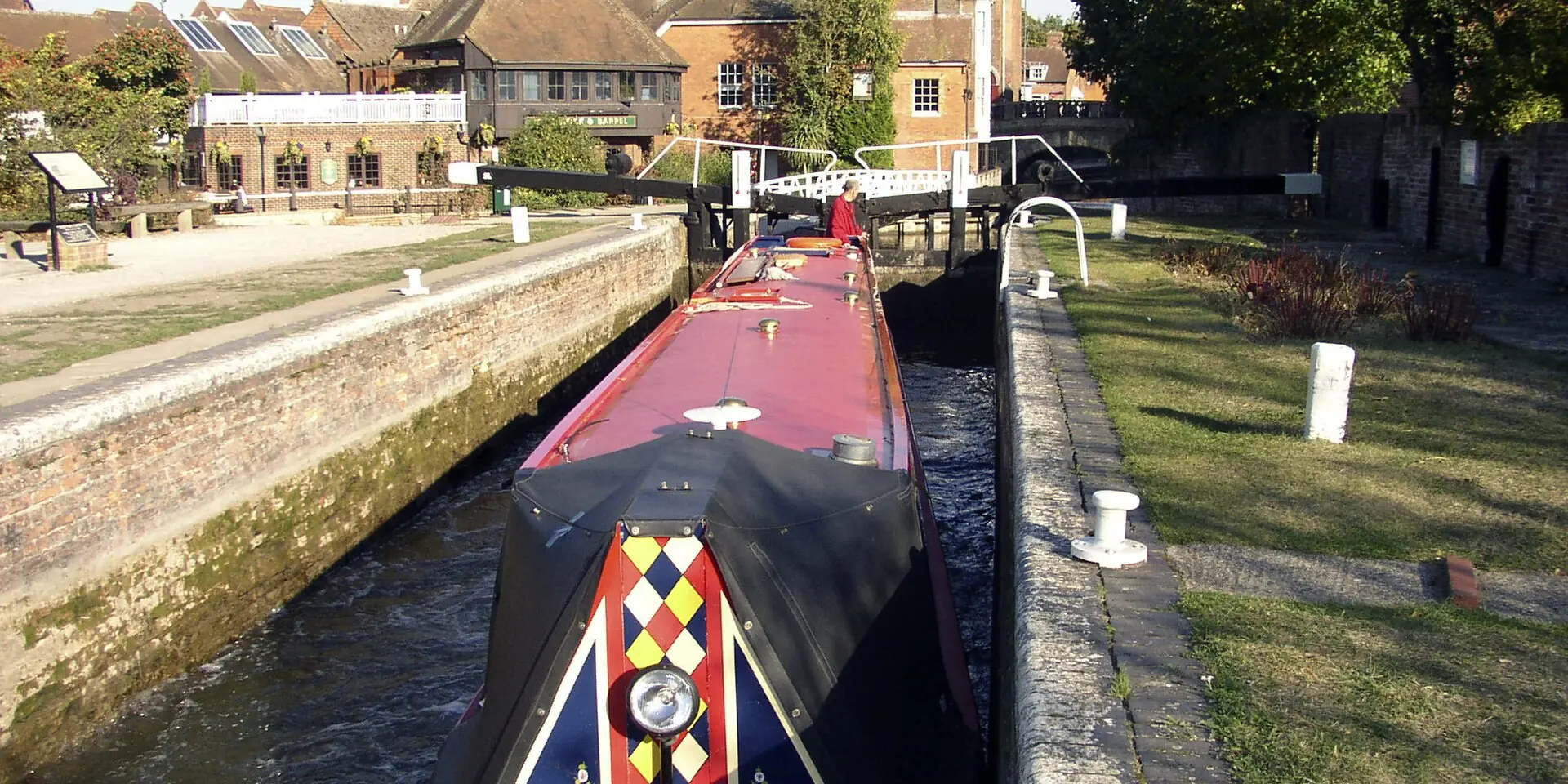 A painted narrowboat in Newbury Lock on the Kennet and Avon Canal