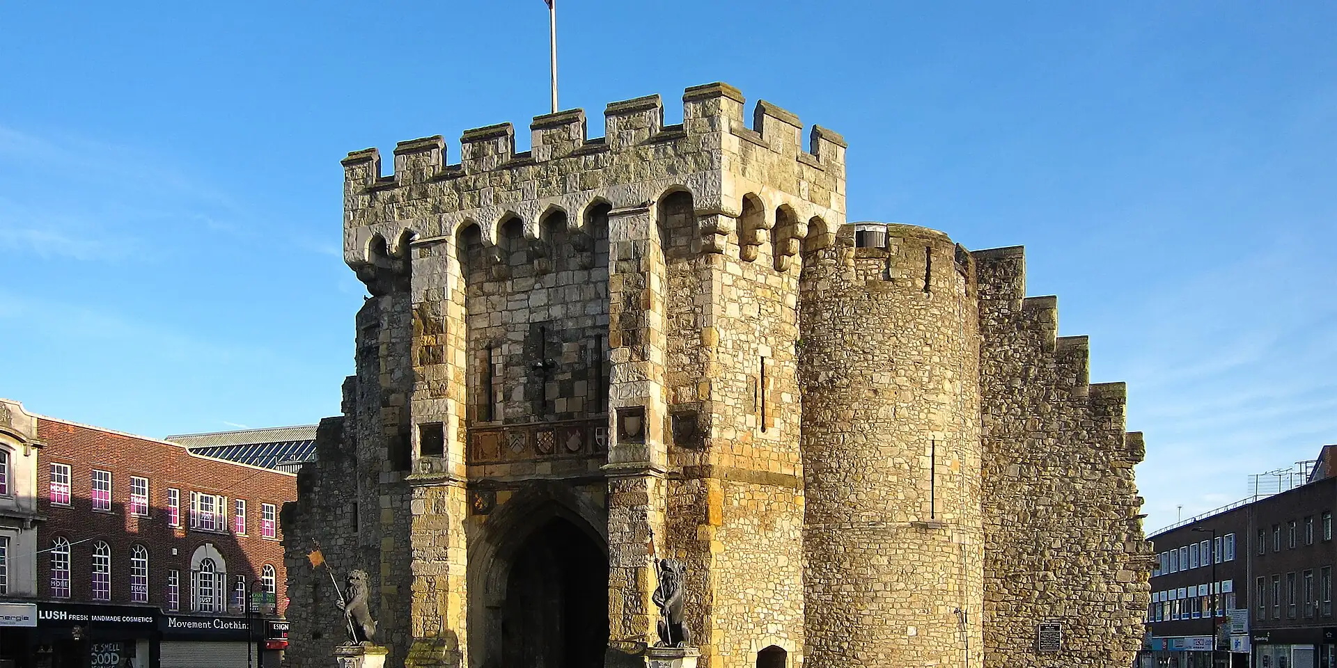 Southampton's Bargate, a medieval stone gatehouse with battlements, under a blue sky